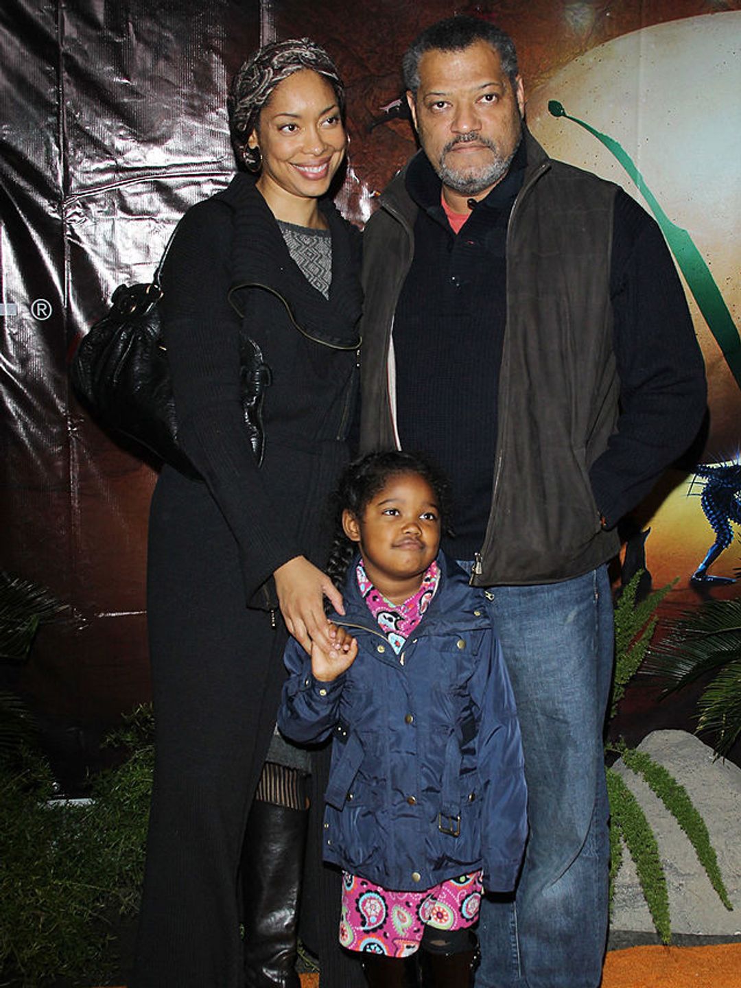 Gina and Laurence with their daughter Delilah on the red carpet