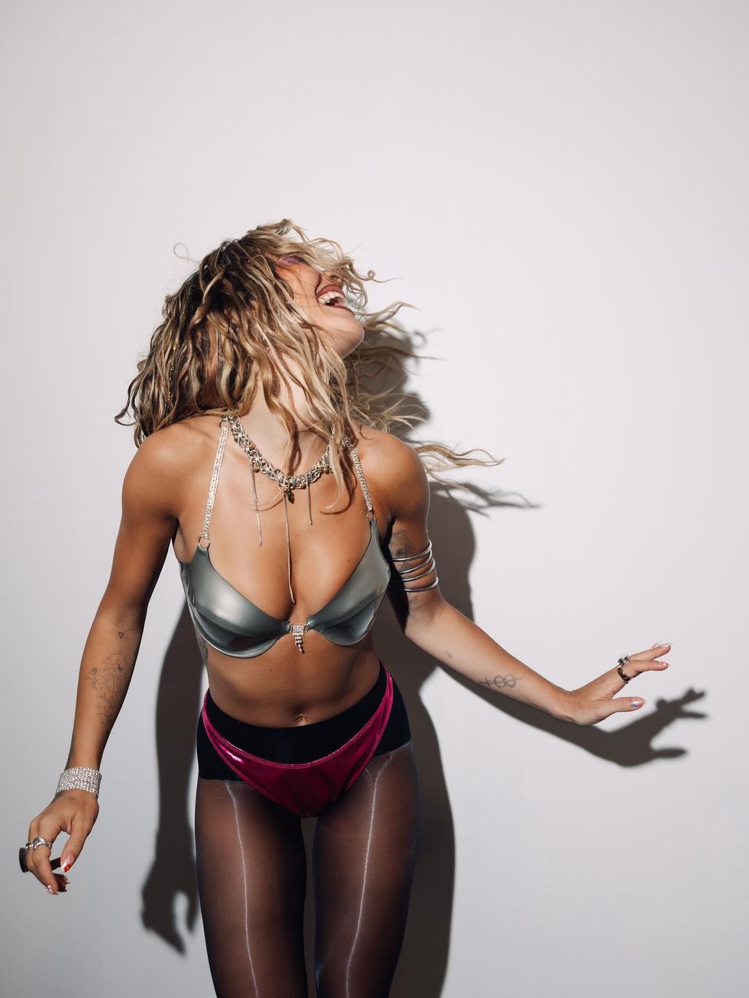 Rita Ora shares an image of herself in pink underwear and silver bra on her Instagram