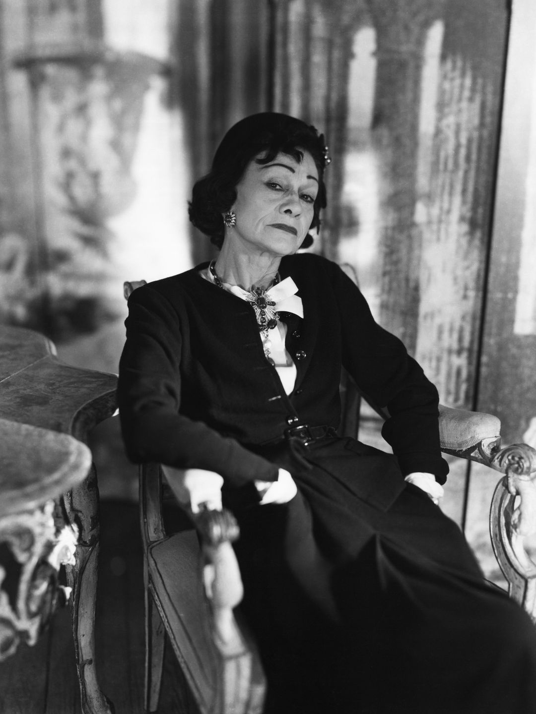 Fashion designer Coco Chanel in her Paris apartment in 1954.