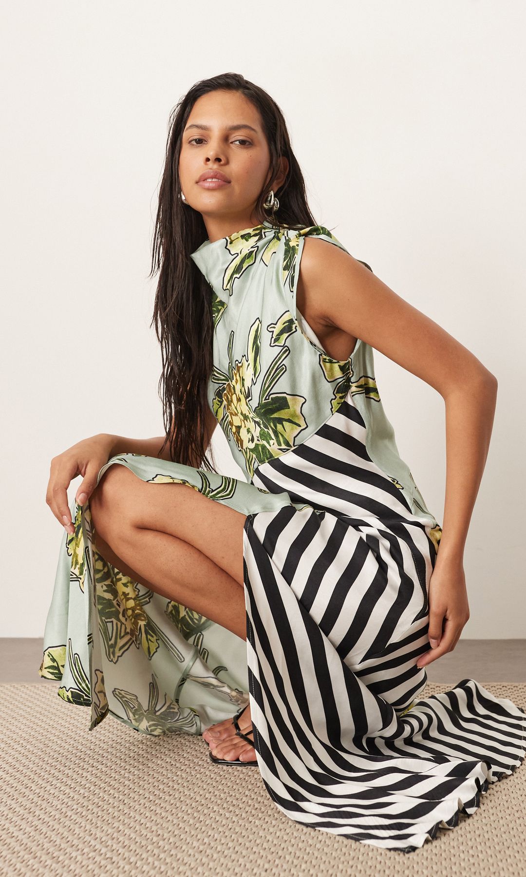 A model wears an ASOS ARRANGE dress