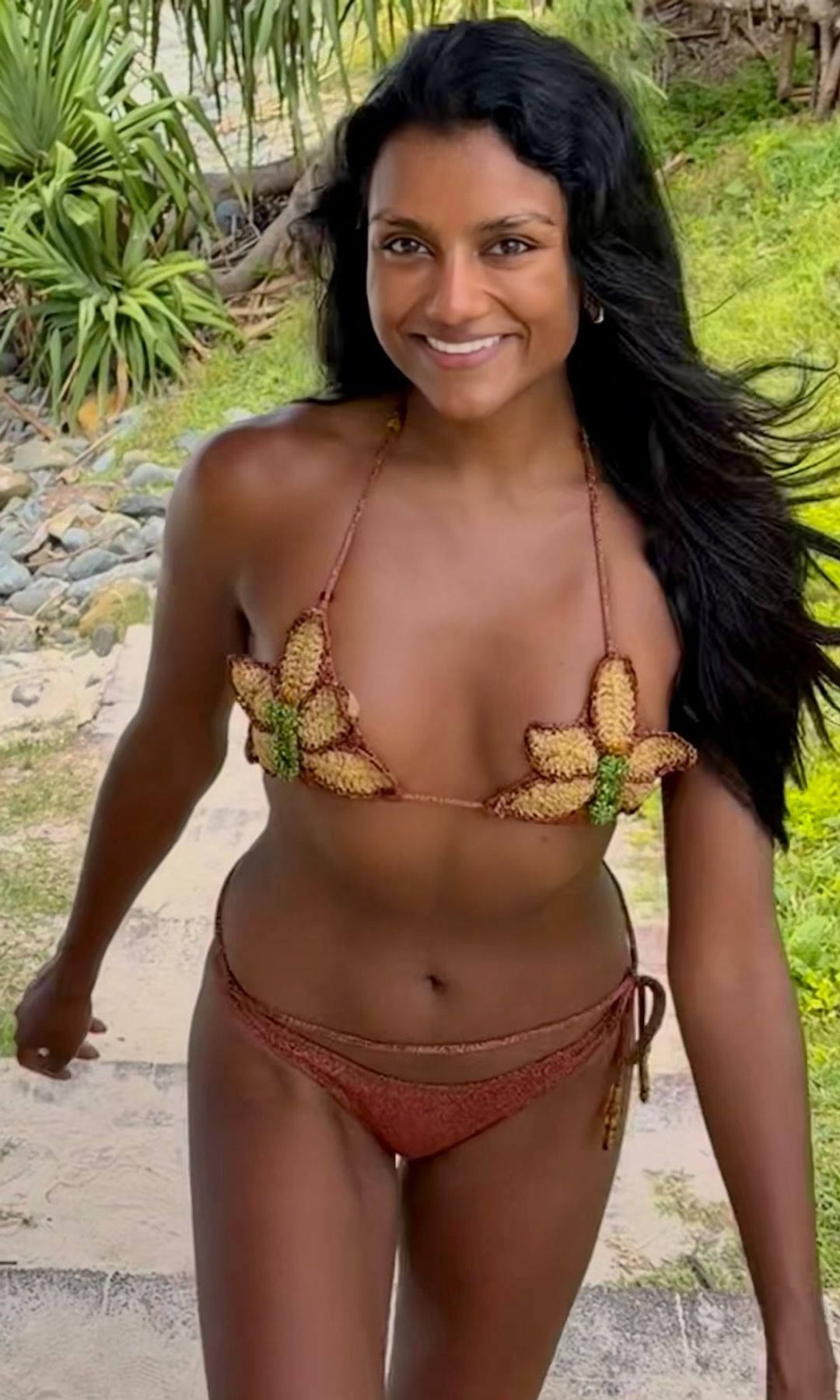 Simone Ashley poses in a bikini while on holiday