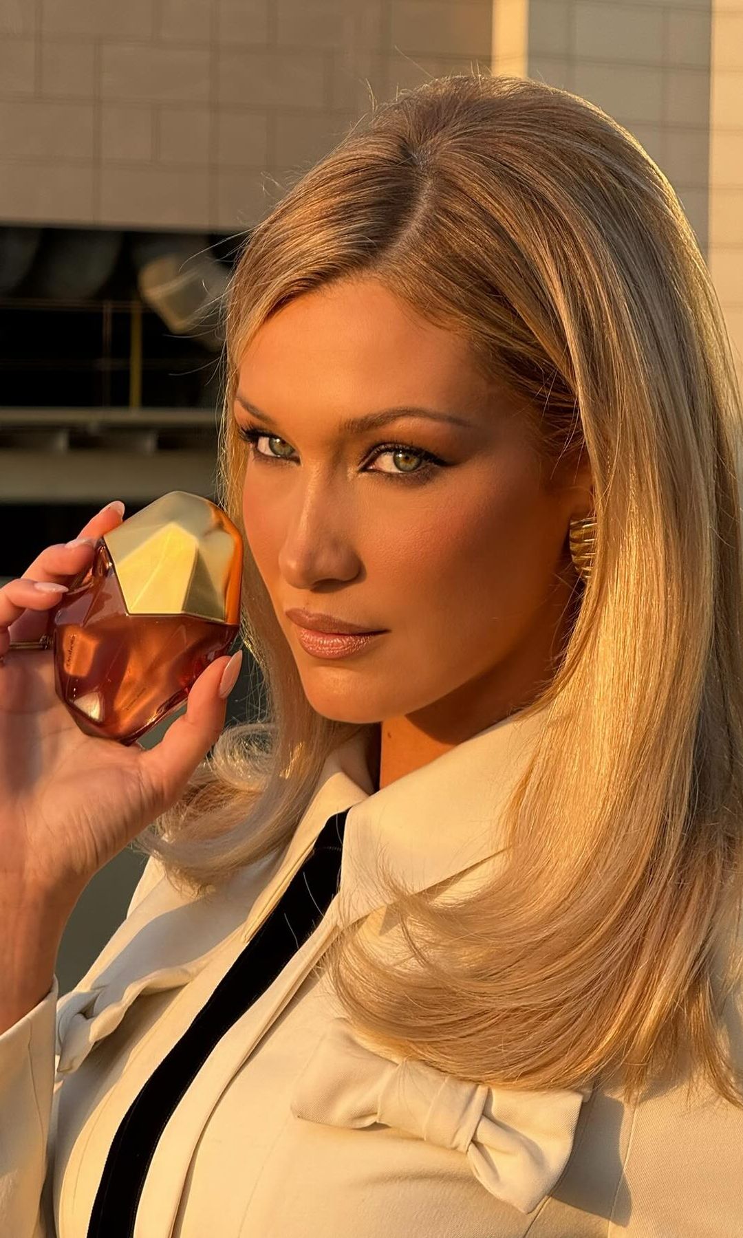 Bella Hadid poses with her Orebella fragrance on her Instagram