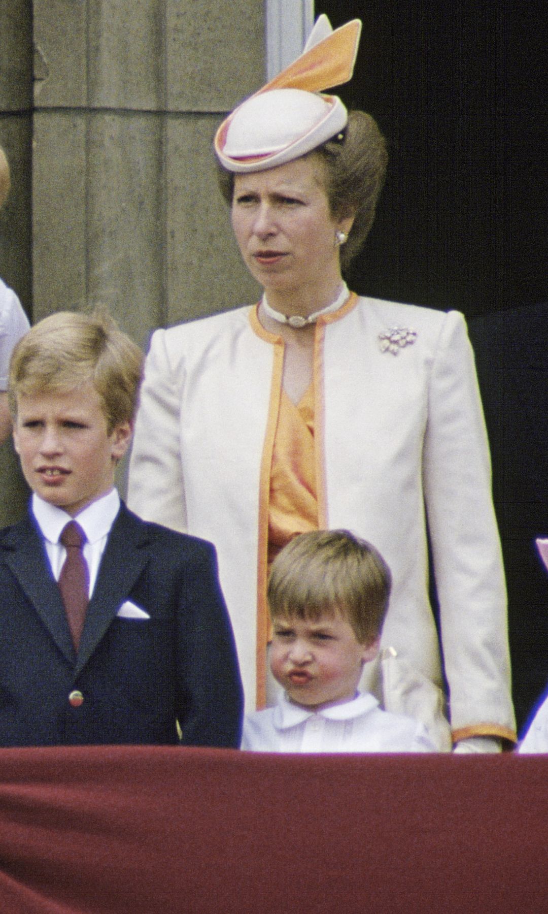Princess Anne in an orange and cream skirt suit at Trooping the Colour