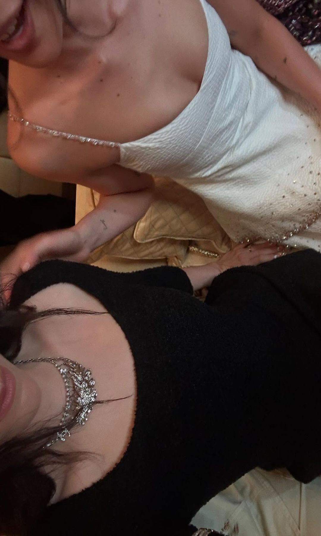 Lorde and Grace Abrams pose for a close up of their outfits