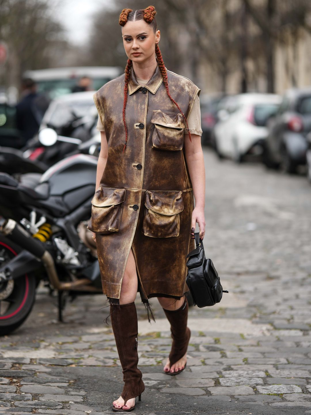 woman with a faded leather look and braids