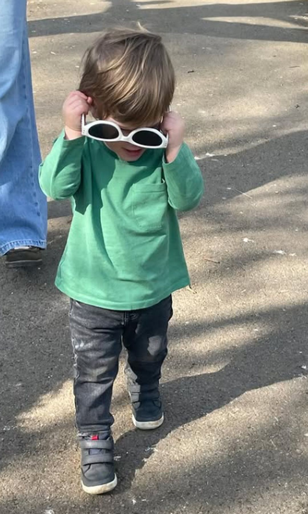 Ernest Brooksbank walking with a pair of upside down sunglasses