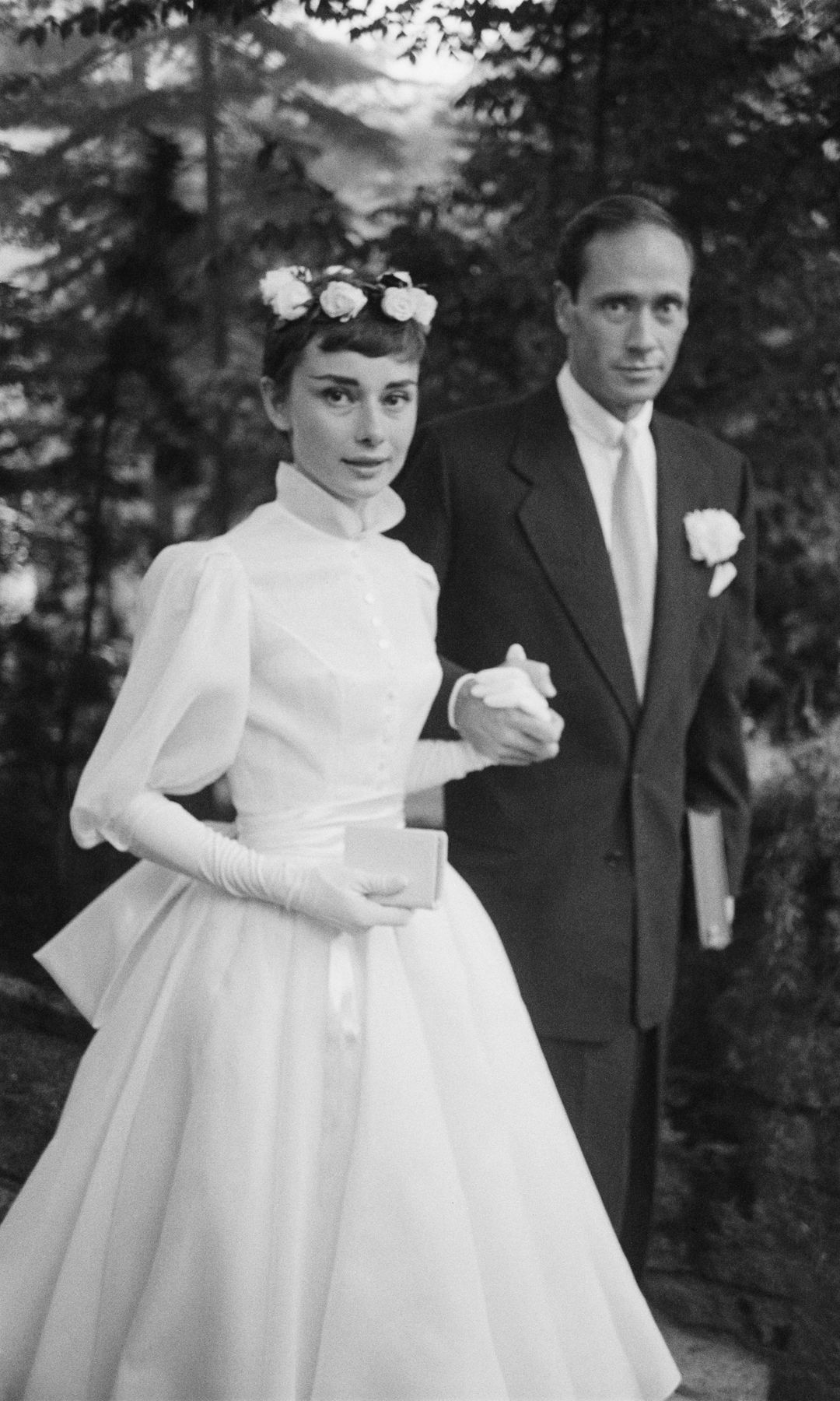 Film star couple Audrey Hepburn (1929 - 1993) and Mel Ferrer on their wedding day. Dress designed by Balmain.