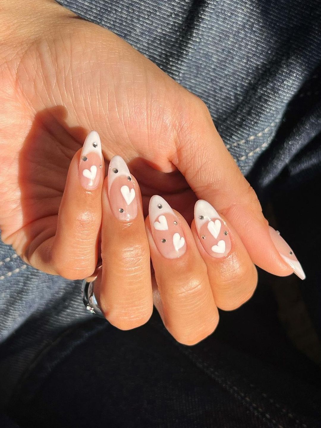 White tip nails with white hearts 