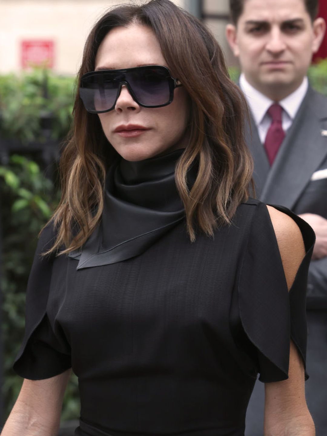 Victoria Beckham  styles her mid-length cut effortlessly. 
