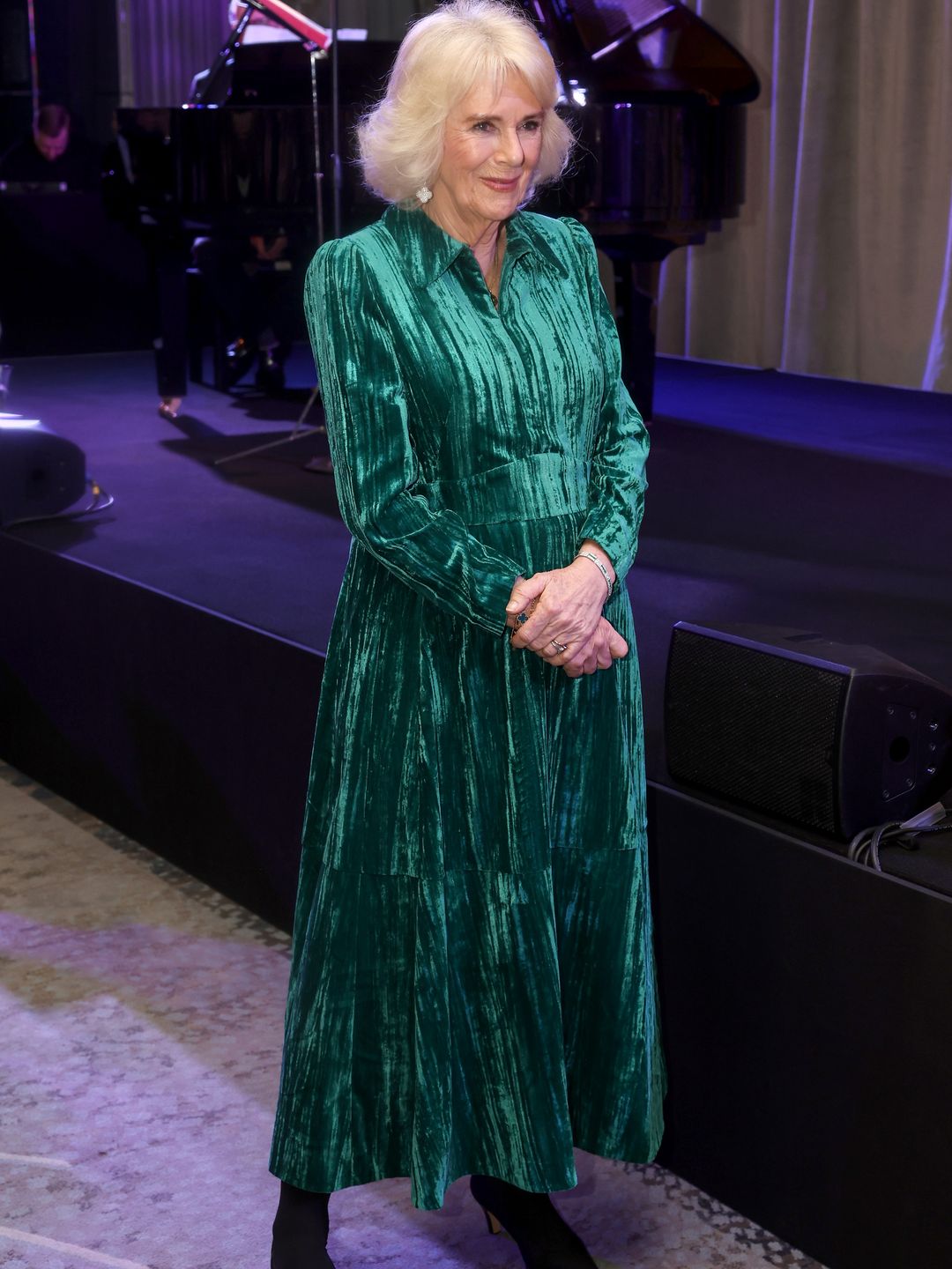 Queen Camilla recycled a velvet emerald green dress for her London outing