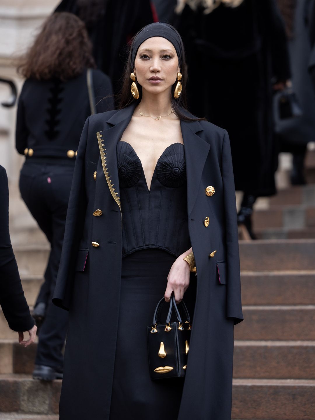 Soo Joo Park attends the Schiaparelli Haute Couture Spring/Summer 2024 in an all black outfit. 