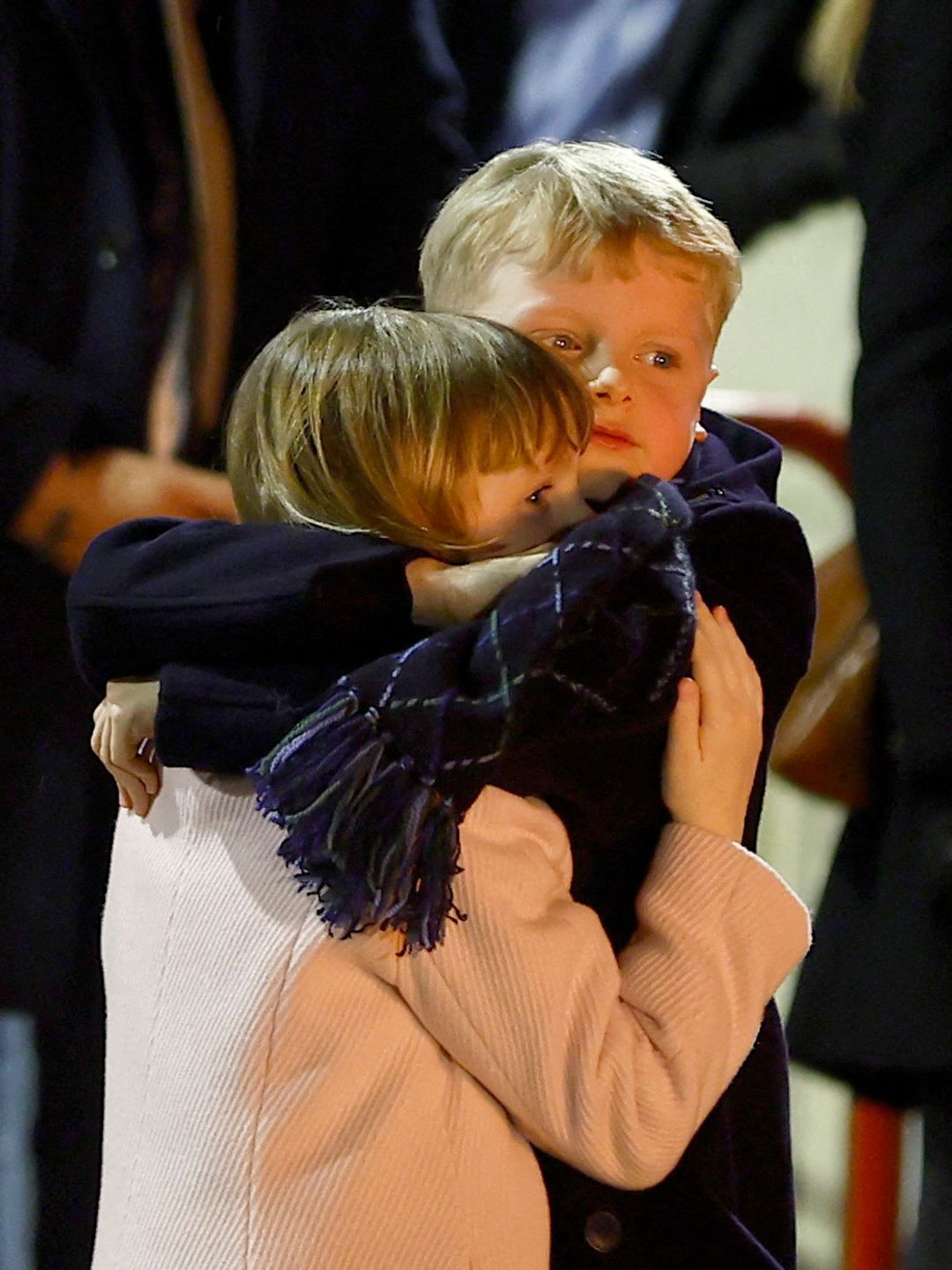 brother and sister hugging