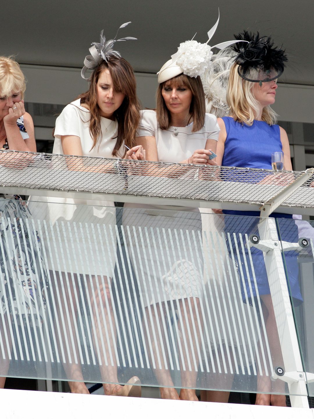 Carol Vorderman and daughter Katie watch horse racing in matching white outfits