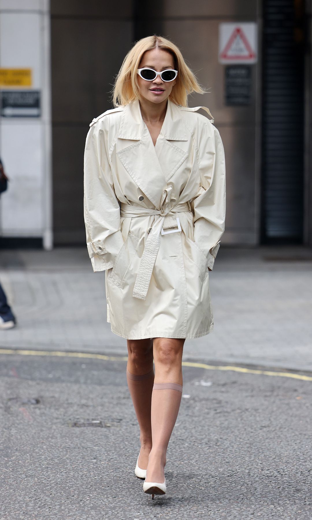 Rita Ora leaving BBC Radio One on September 24, 2025 in London, England WEARING A TRENCH COAT