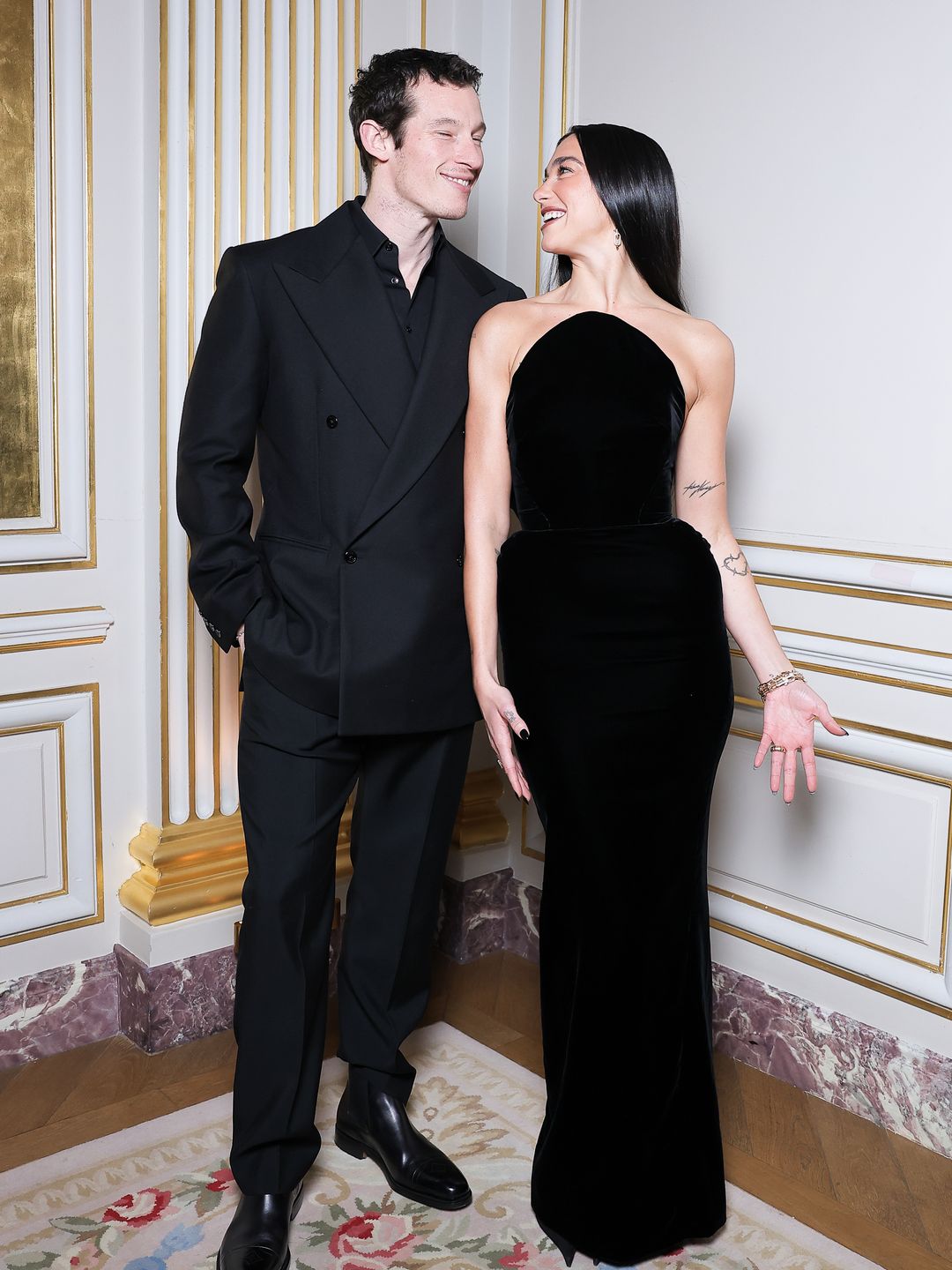 Dua Lipa and Callum Turner pose together for a photo at a Tiffany & Co. event in Paris