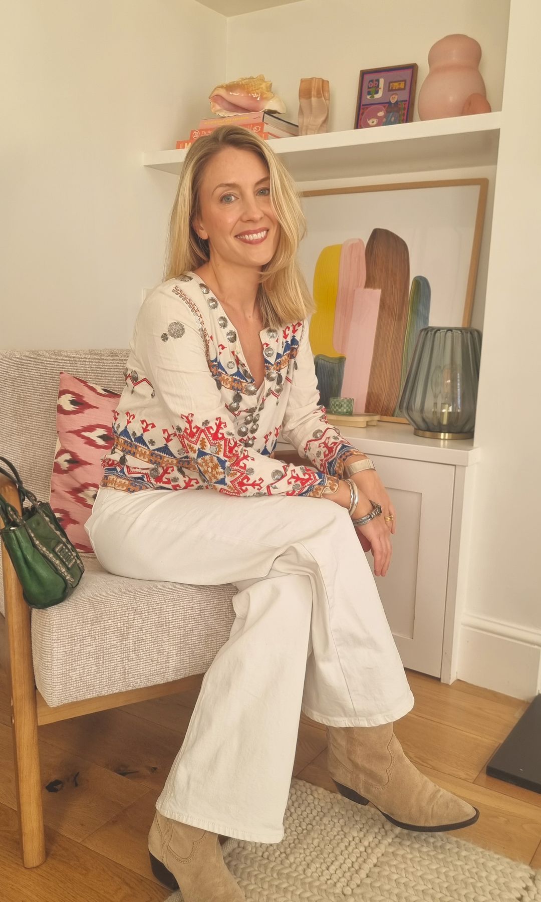 Aliya Wilkinson in white jeans and boots