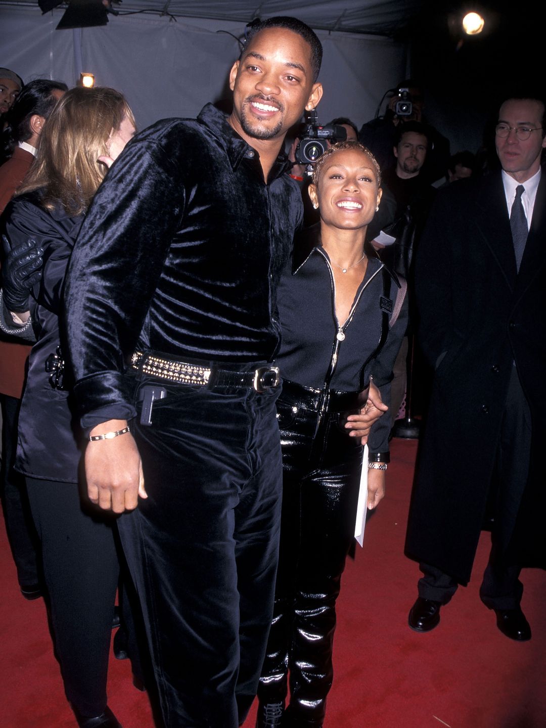 Jada and Will smiling in an old photo from a red carpet event