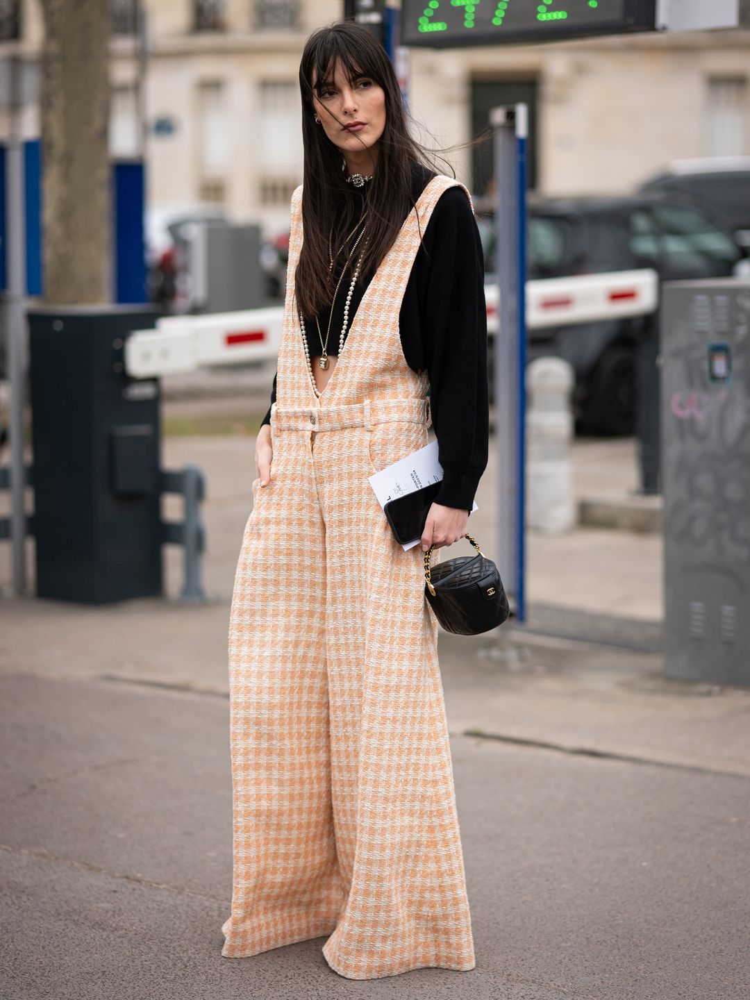 Leia Sfez wears peach Chanel overalls during Paris Fashion Week AW23