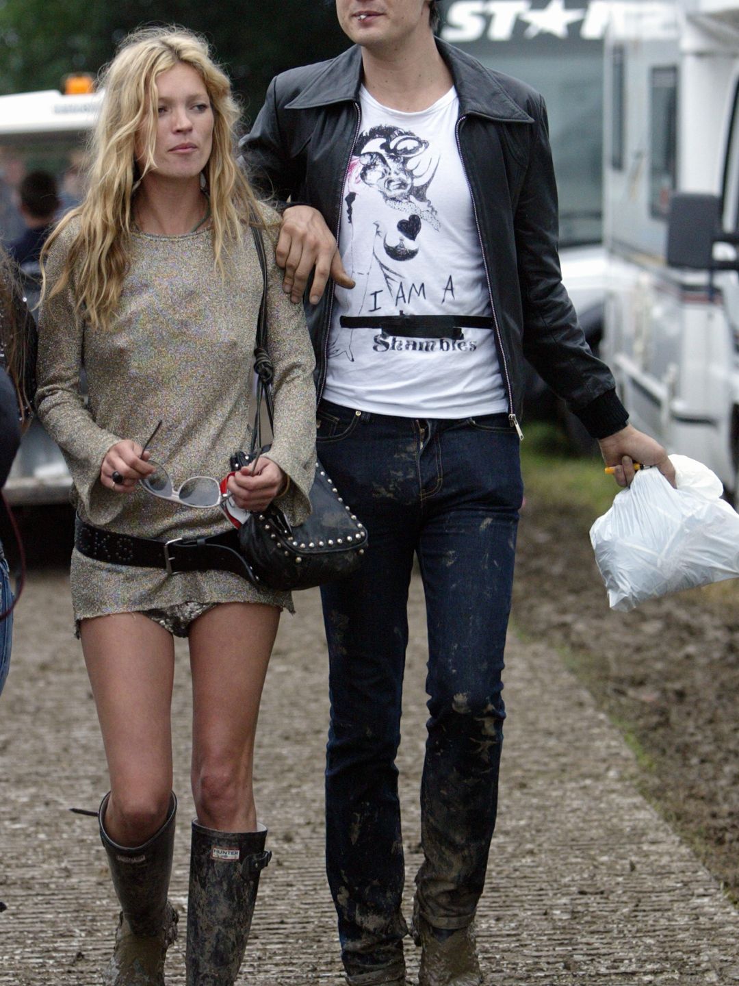 Kate Moss wears wellington boots and a sparkly top to Glastonbury in 2005