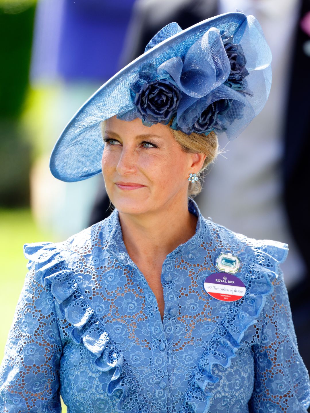 woman wearing blue saucer hat 