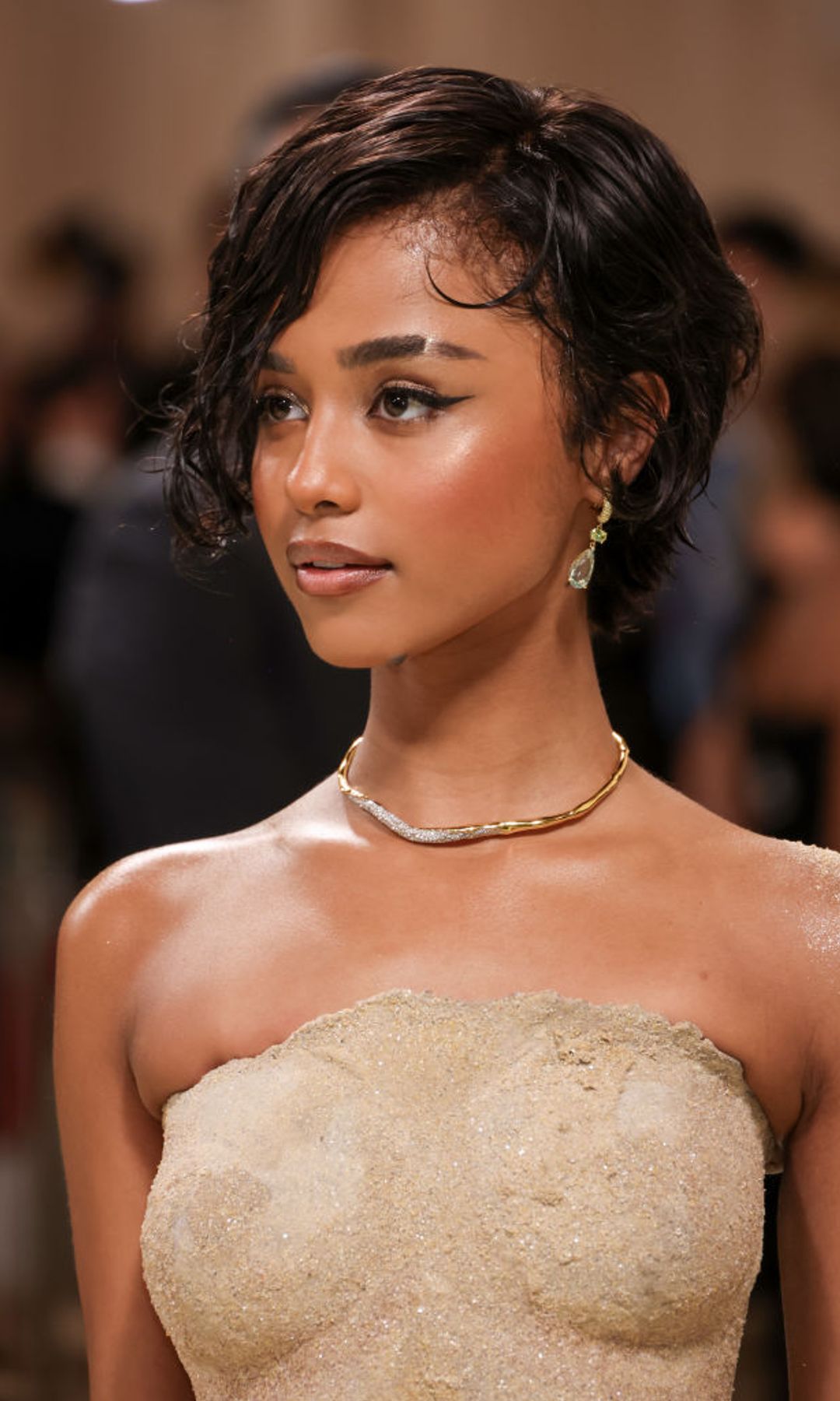Tyla with a short crop cut and glazed skin 
