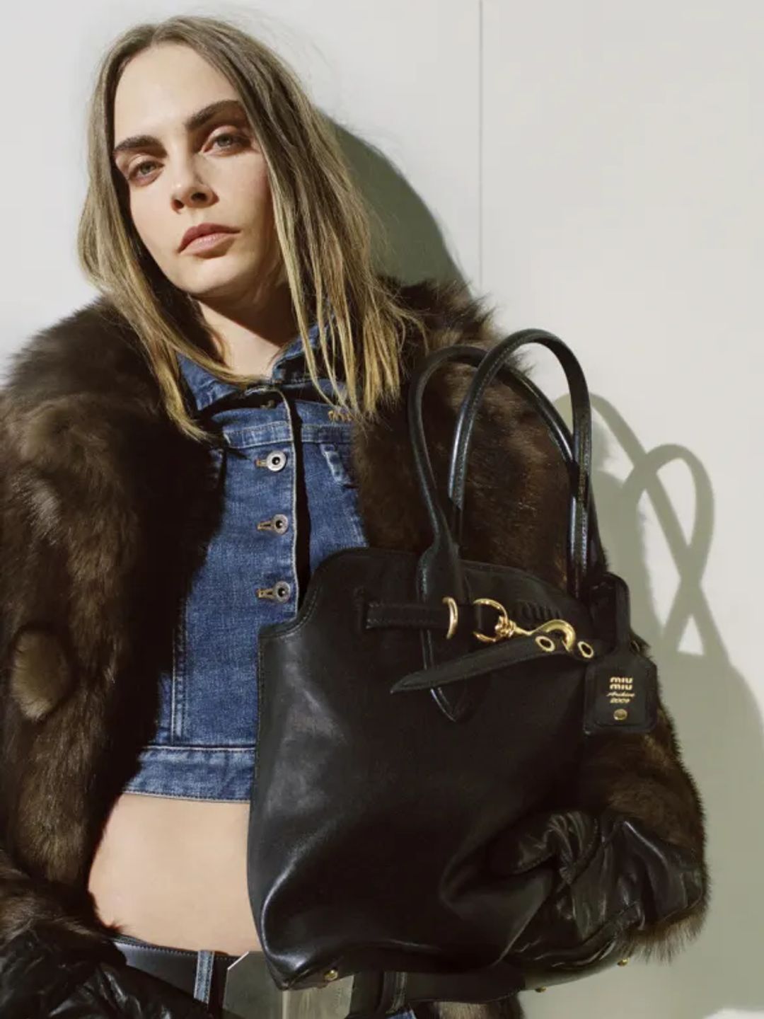 The It-Brit posed in a series of decadent furs, denim duos and luxurious accessories