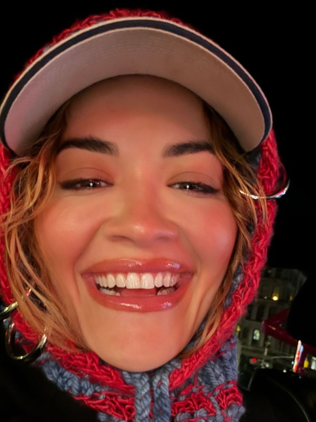 Just yesterday Rita Ora paired her chunky knit hood over a cap