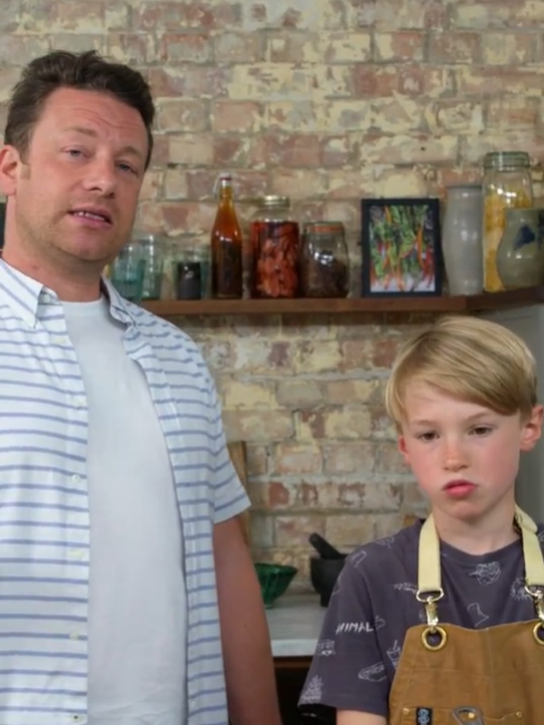 Jamie and his son Buddy standing in Jamie Oliver HQ Kitchen