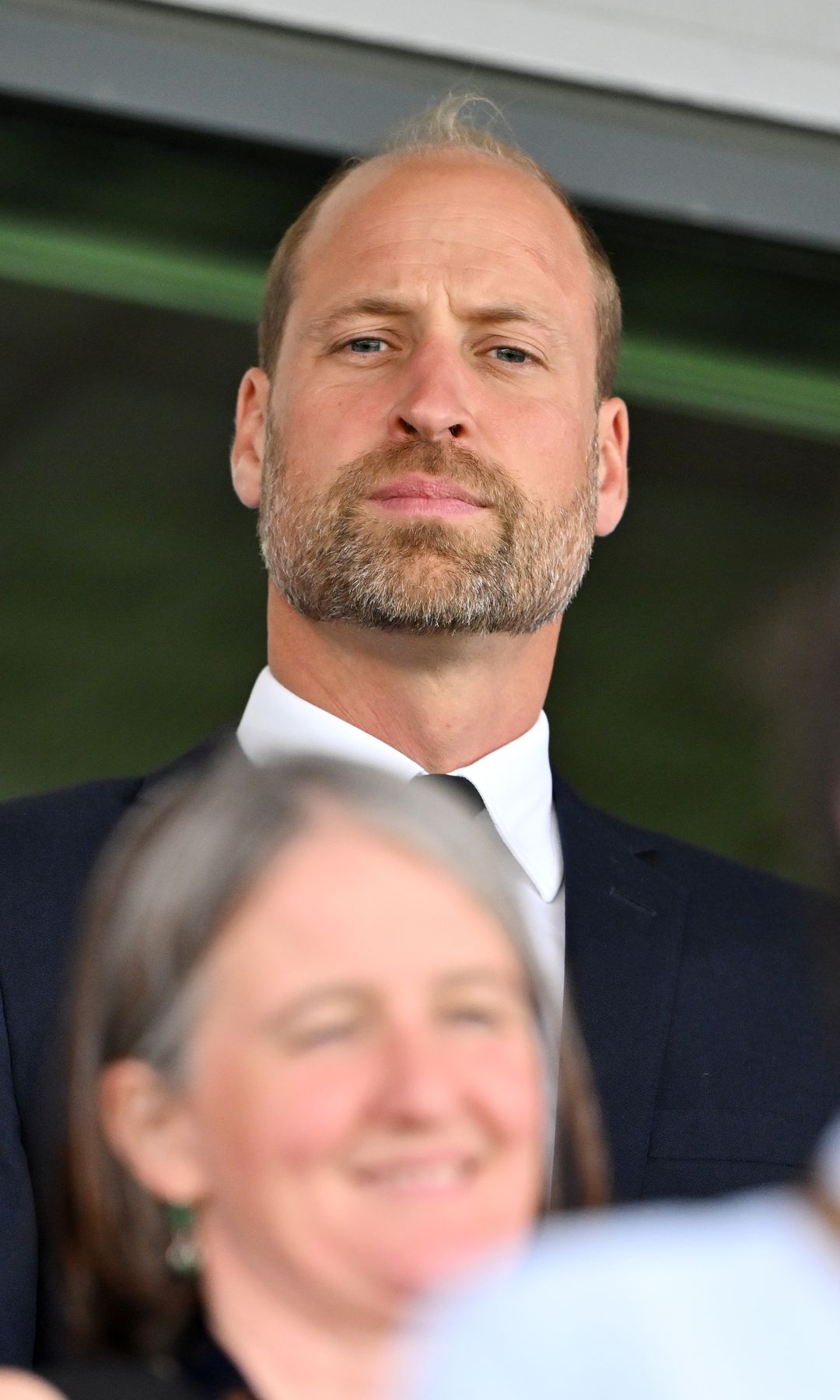 Prince William looking mad at a rugby game