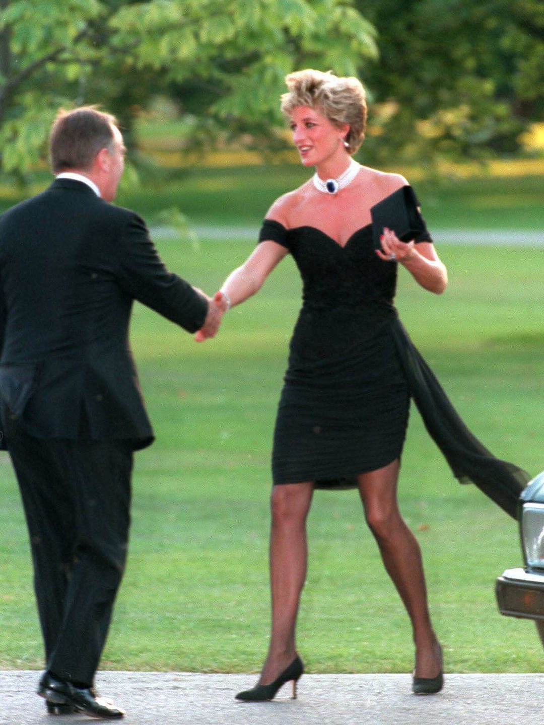 Diana, Princess of Wales, wore her famous black "revenge dress" commissioned from Christina Stambolian, to attend the Vanity Fair party at the Serpentine Gallery on November 20, 1994