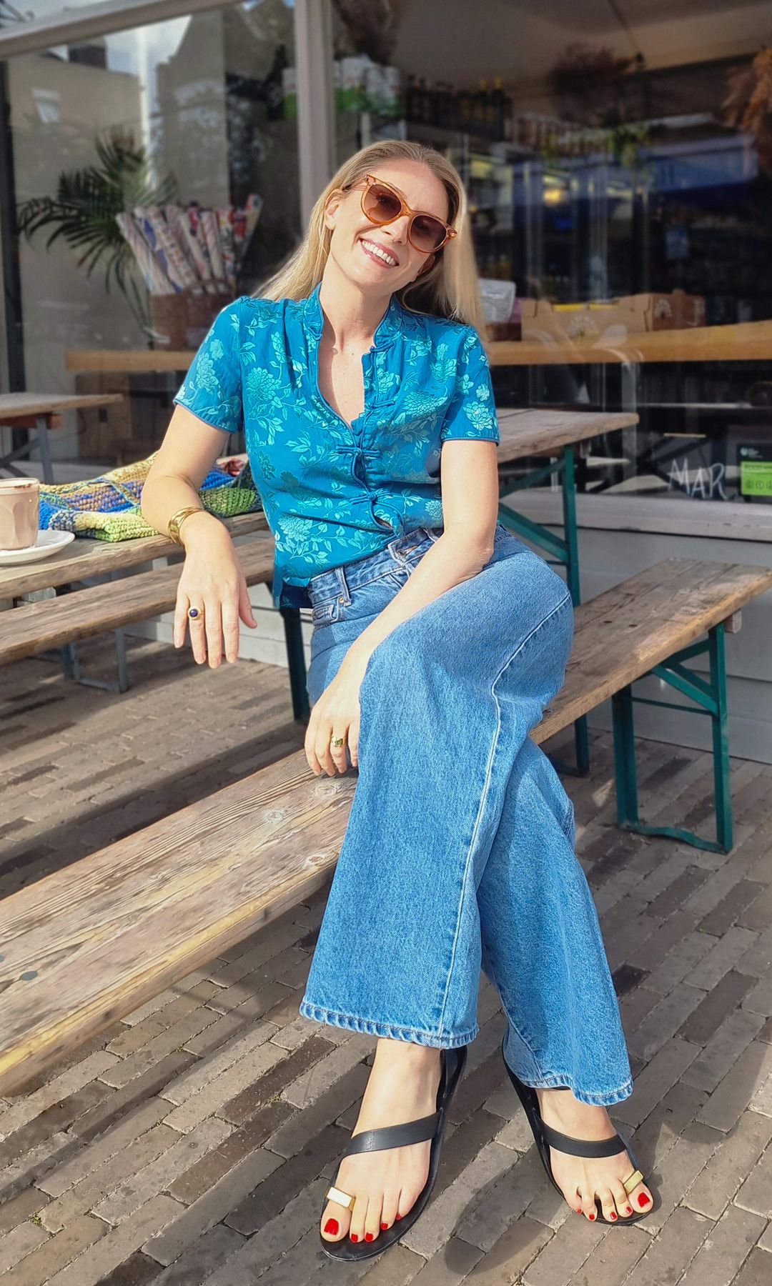 Aliya Wilkinson in blue shirt and jeans