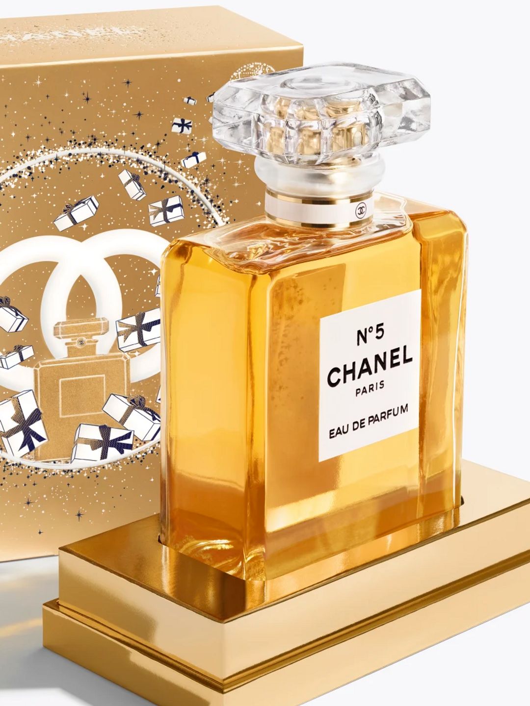 This limited-edition gold and white case, opens to reveal N°5 Eau de Parfum