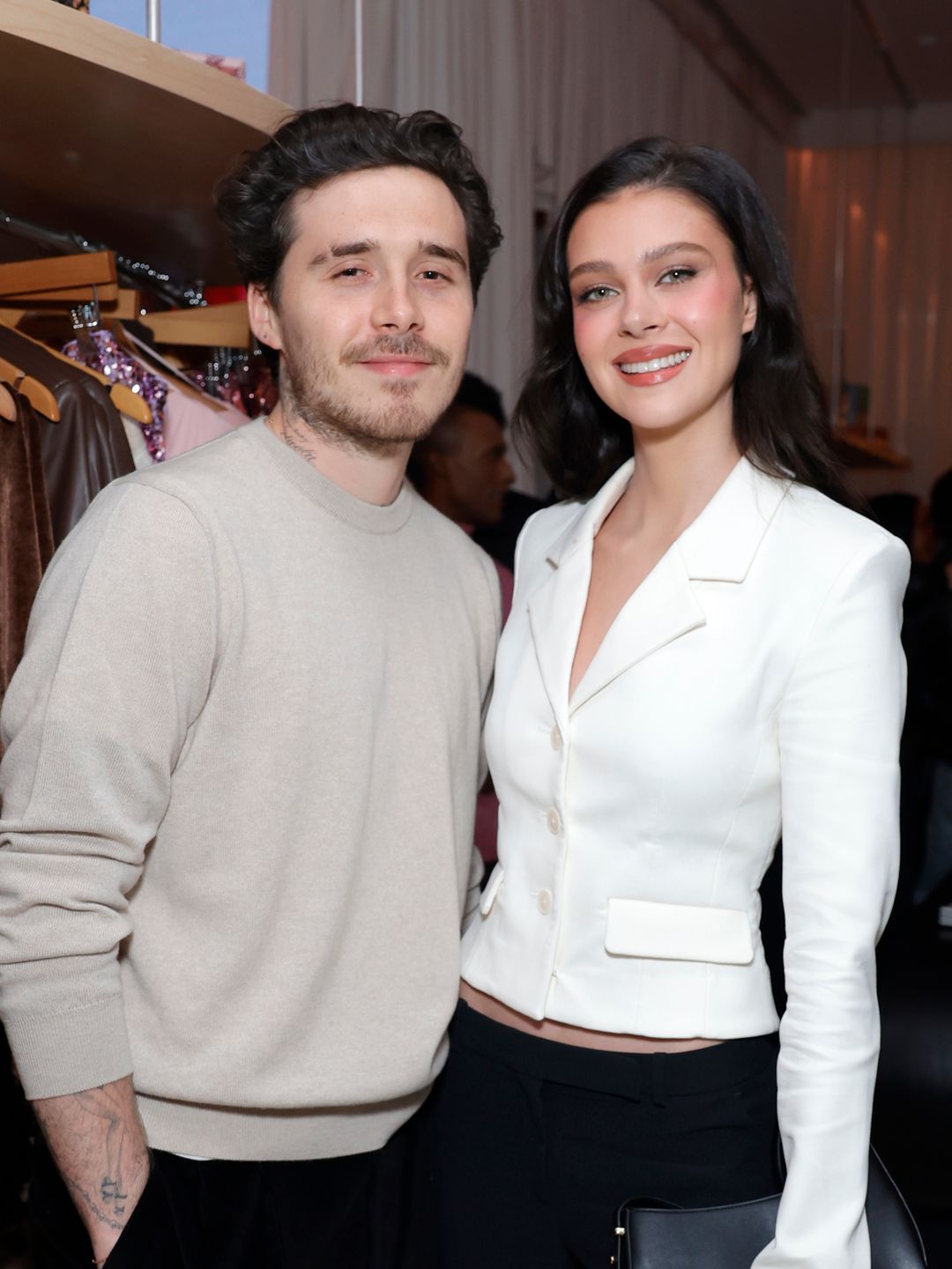 Brooklyn Beckham and Nicola Peltz attend Revolve's Holiday Shop Grand Opening at The Grove on November 14, 2024 in Los Angeles, California.