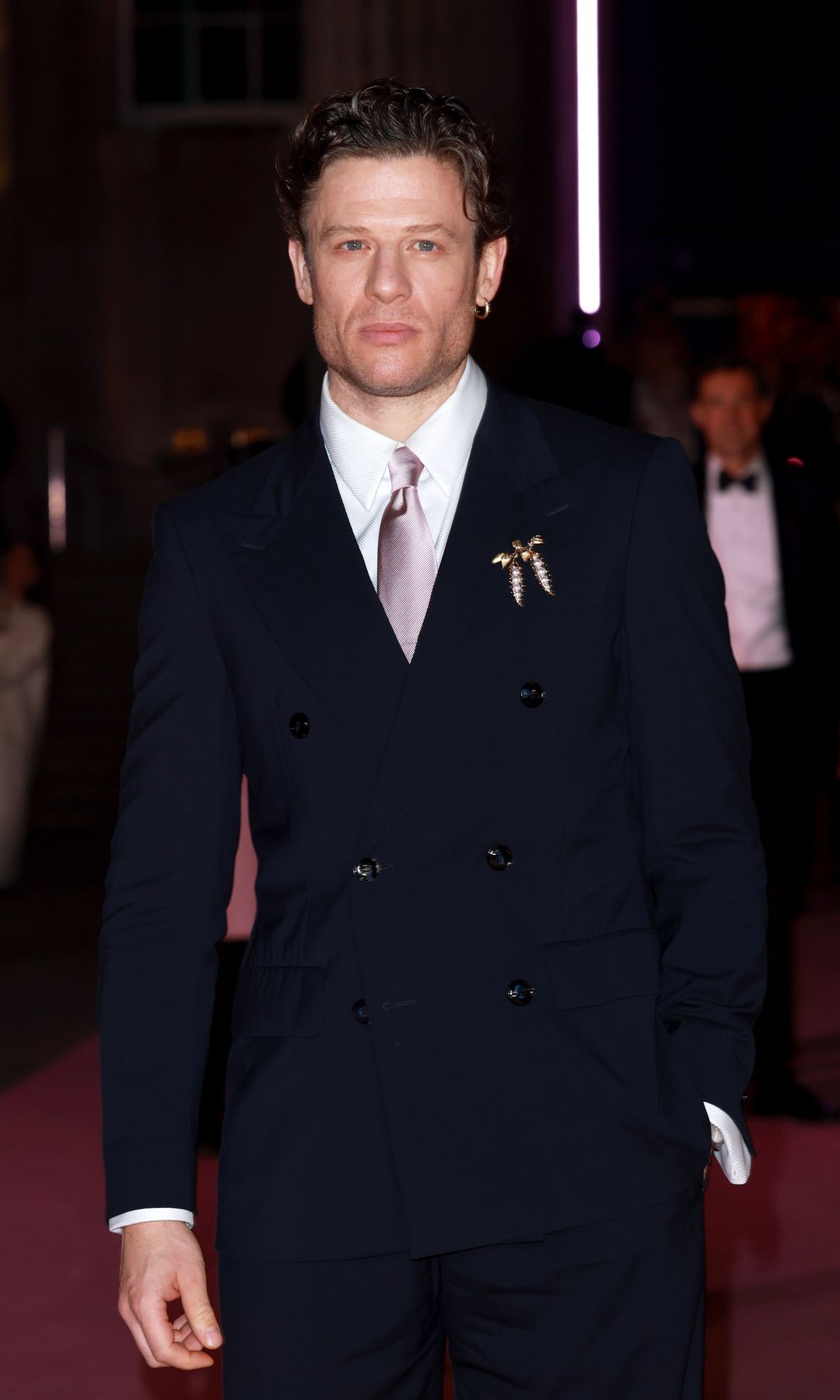 James Norton in a navy blue suit