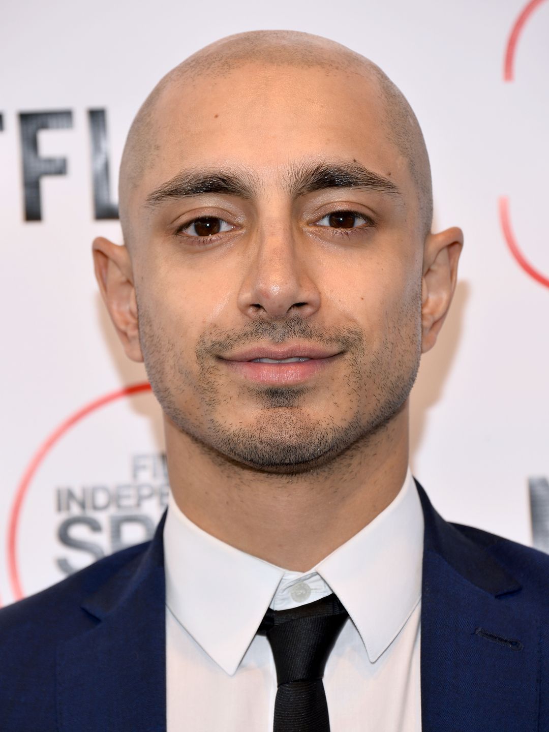 riz ahmed with shaved head