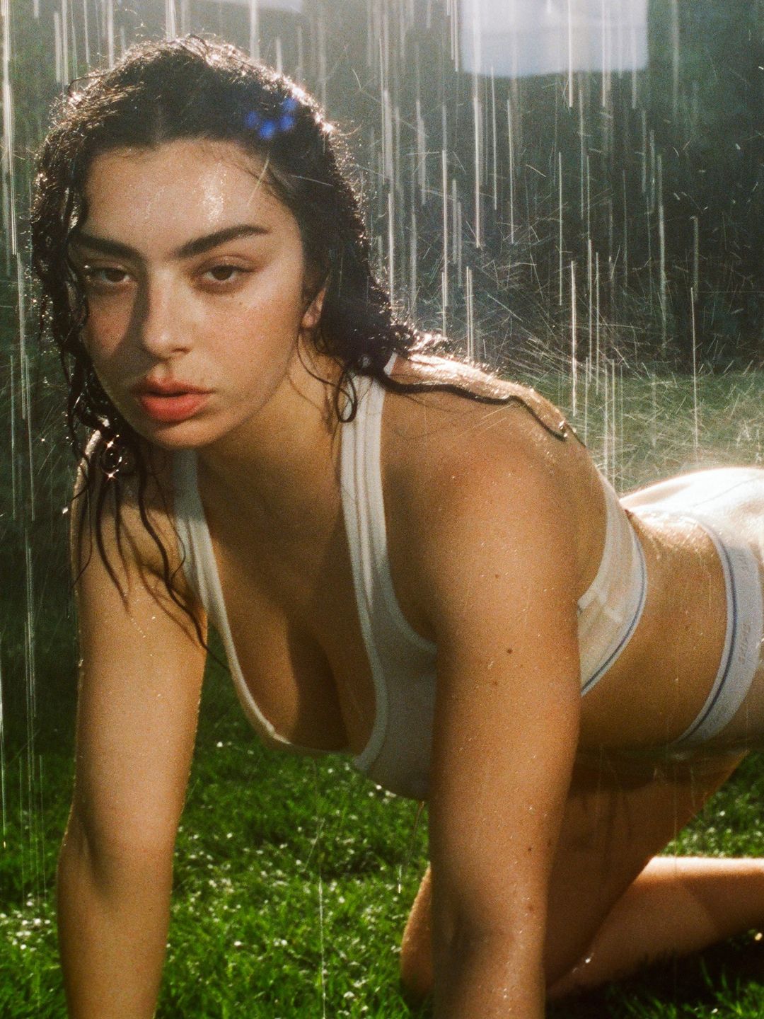 Charli XCX poses for the new Skims cotton range