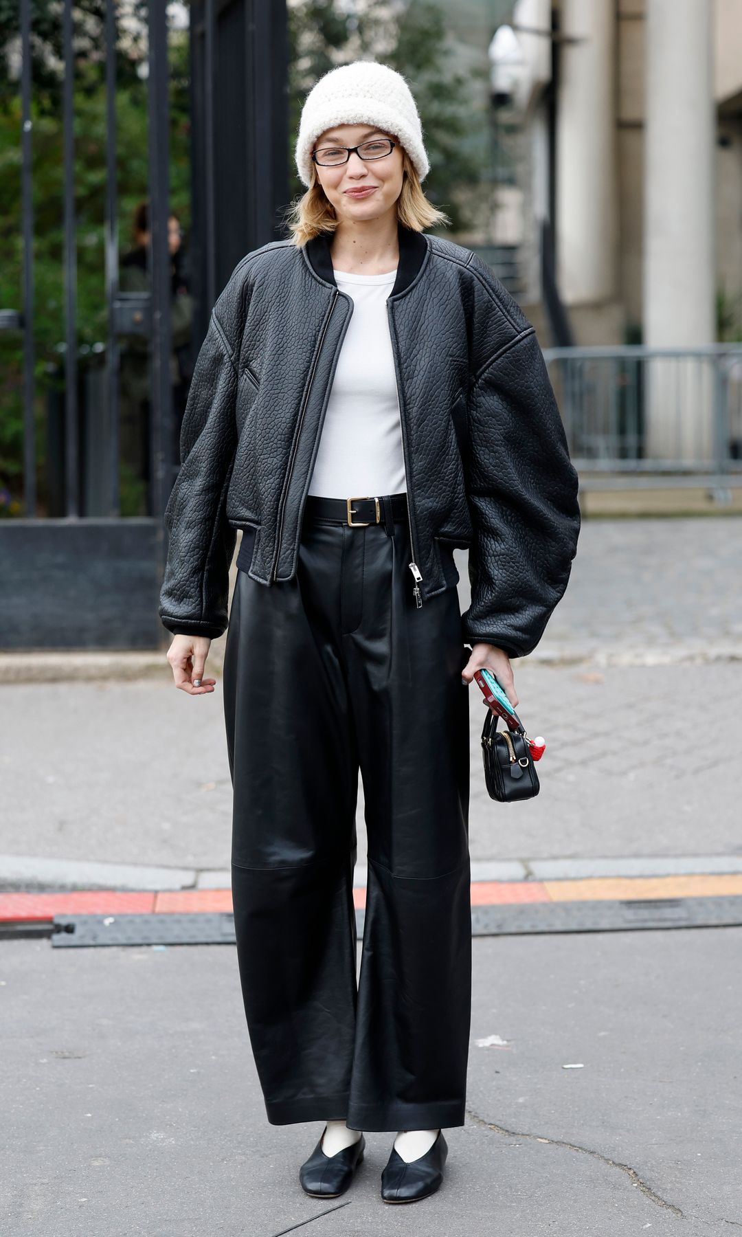 PARIS, FRANCE - MARCH 11: Gigi Hadid outside the Miu Miu AW25 runway show