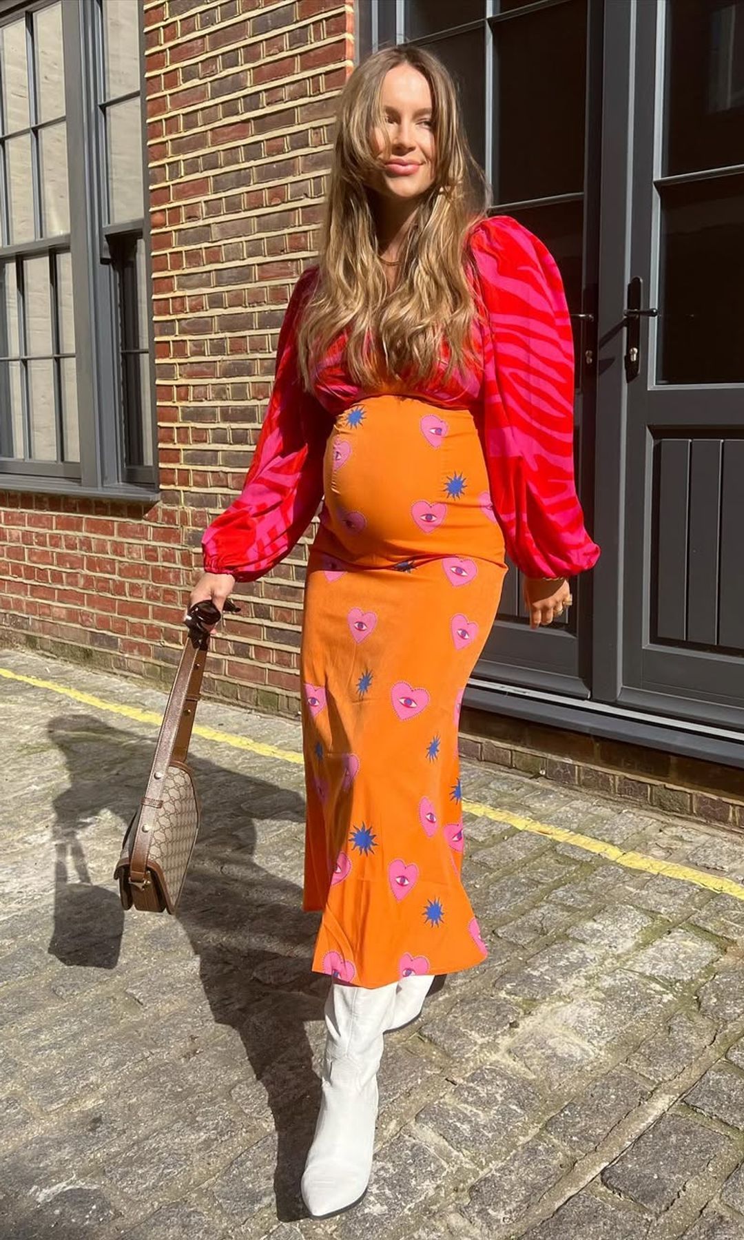 Emma Louise Connolly in a red/orange dress