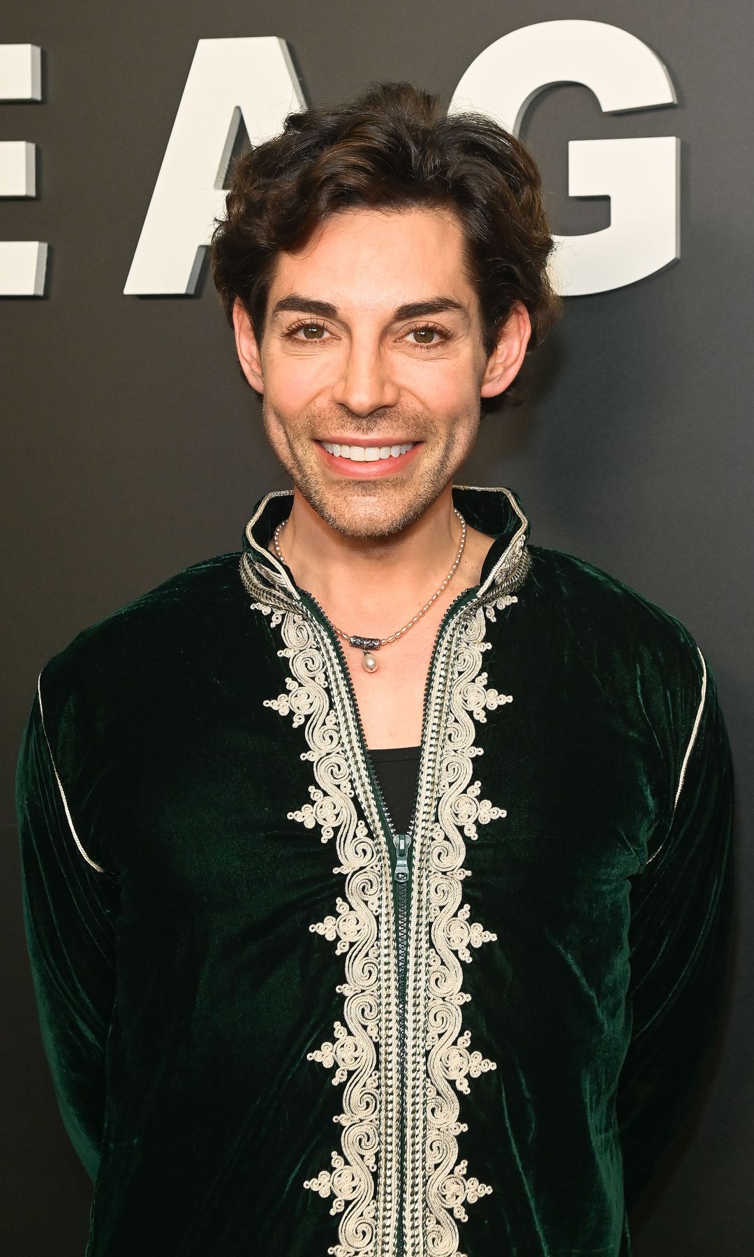 Tom Read wilson in a velvet outfit