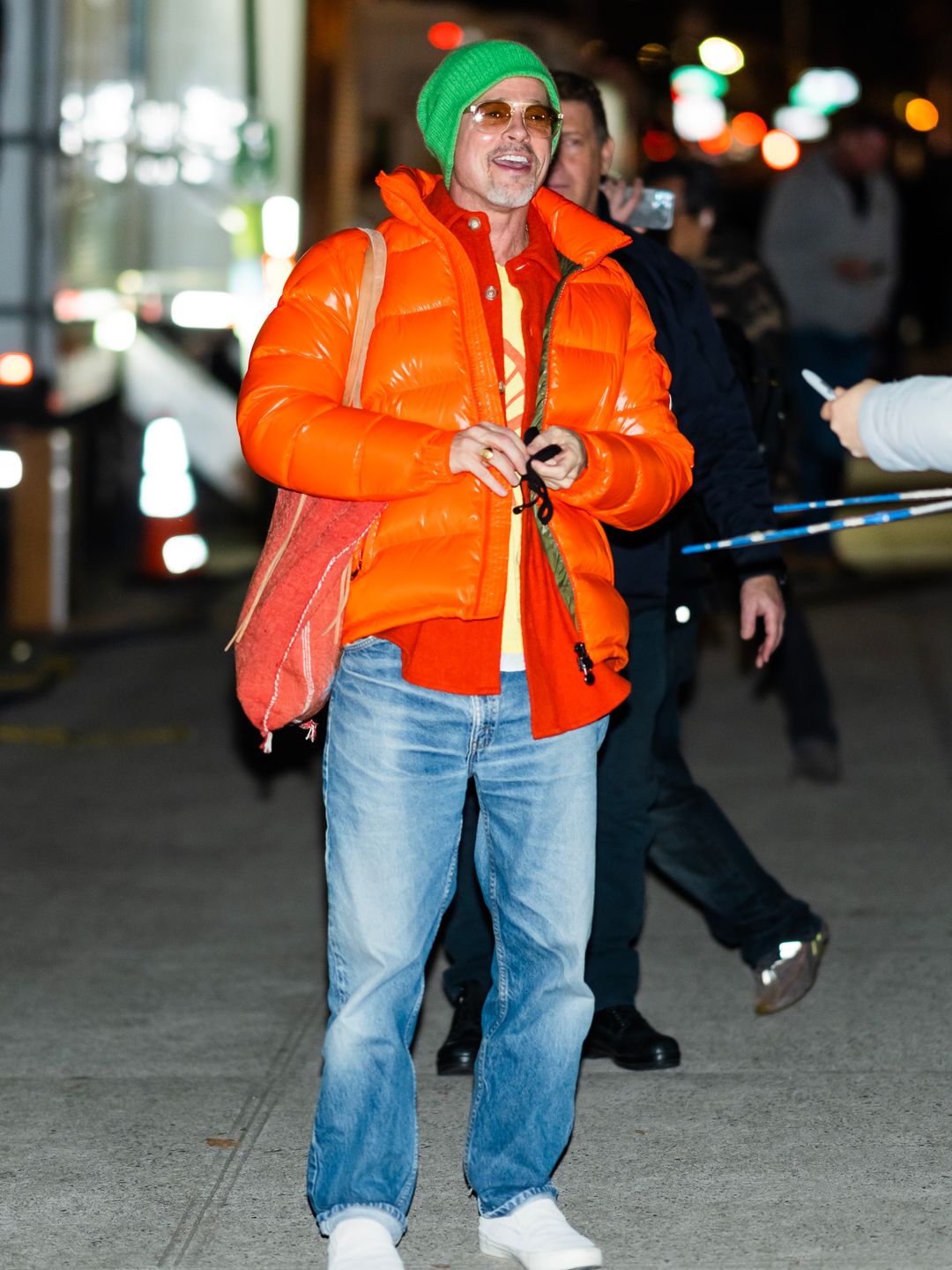 brad pitt in orange puffer