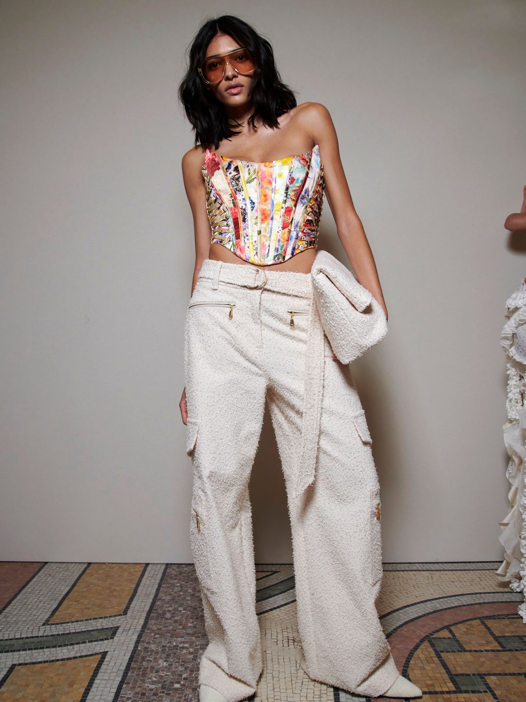 Zimmermann model in colourful corset and slouchy jeans 