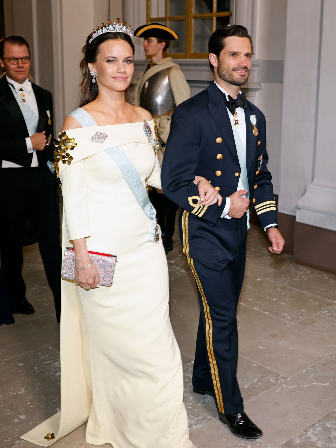 Princess Sofia of Sweden and Prince Carl Phillip of Sweden attend the Jubilee banquet during the celebration of the 50th coronation anniversary of King Carl Gustav. Sofia Wore a white off the shoulder gown