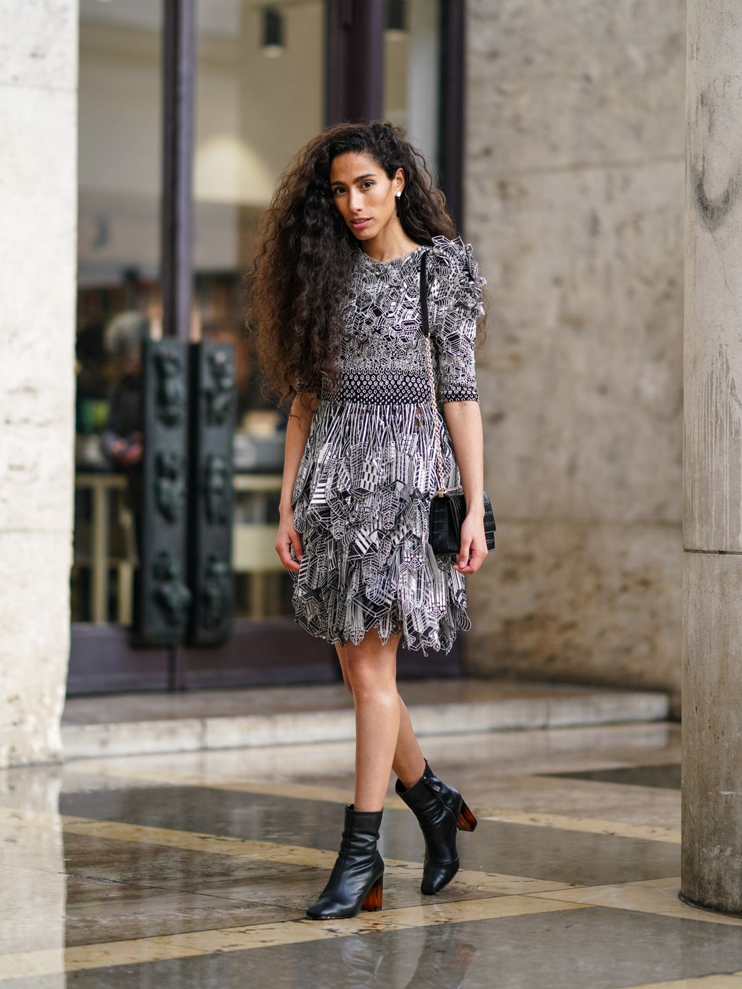 Singer Ciinderella Balthazar shows off her voluminous curls during Paris Fashion Week