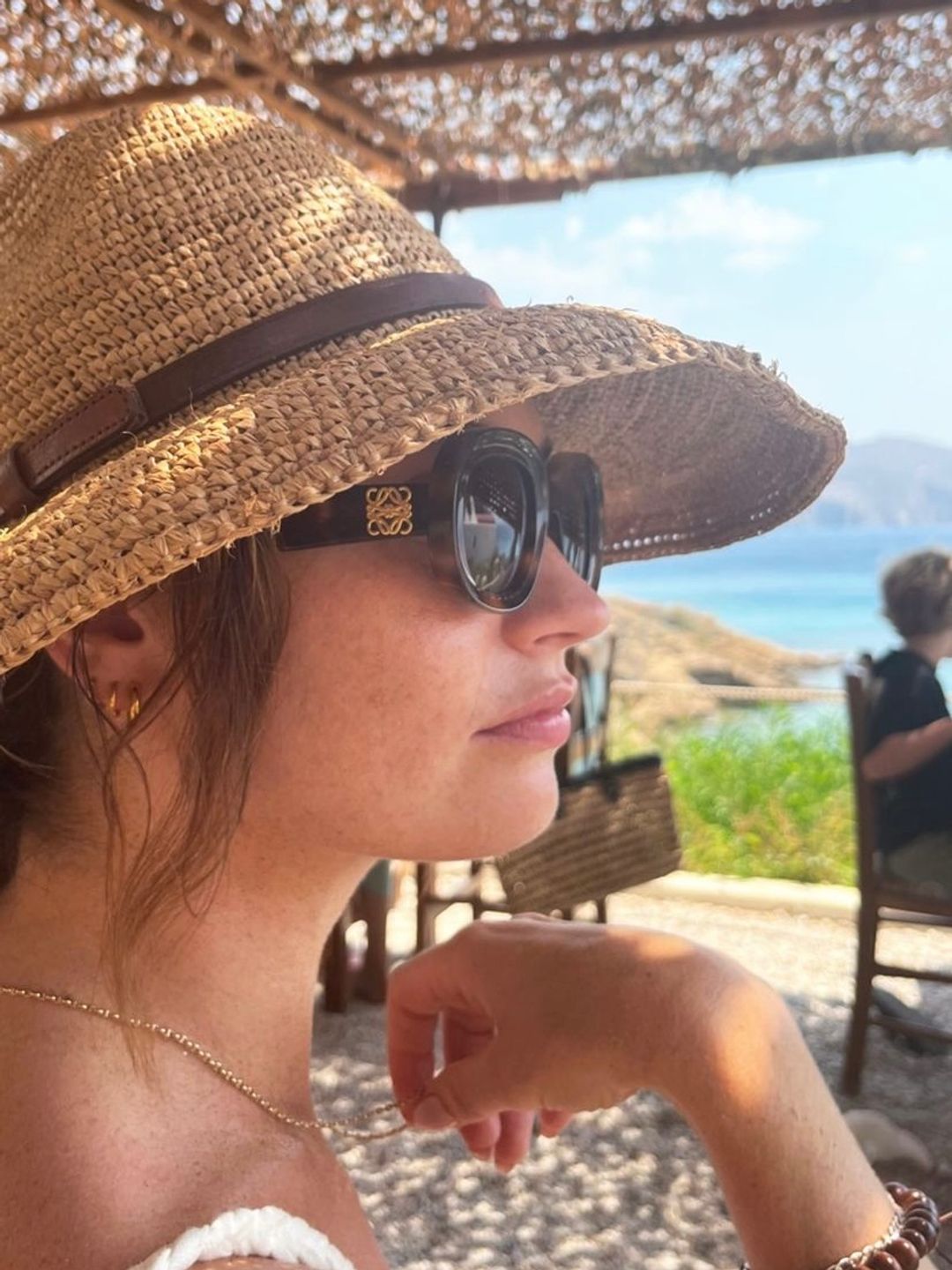 Lily James wearing a pair of tortoiseshell Loewe shades 