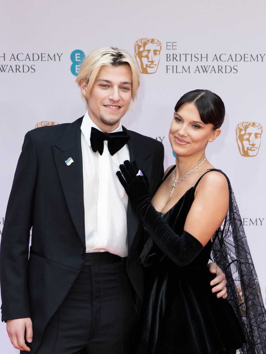 Jake Bongiovi  and Millie Bobby Brown attend the EE British Academy Film Awards 2022 at Royal Albert Hall on March 13, 2022 in London, England