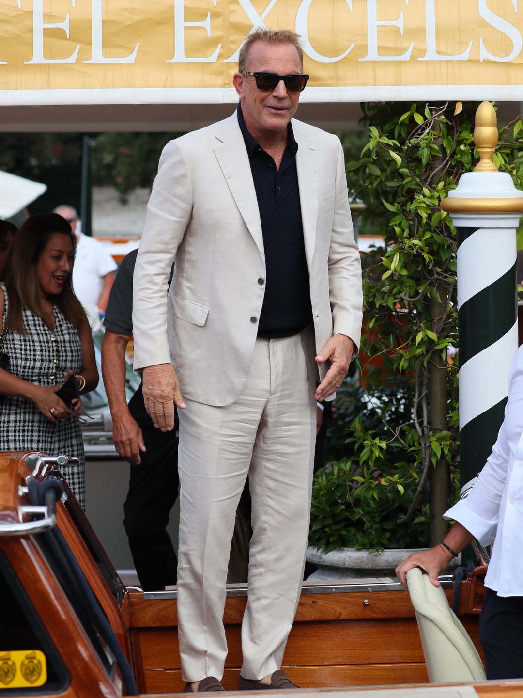 Kevin Costner in a white suit