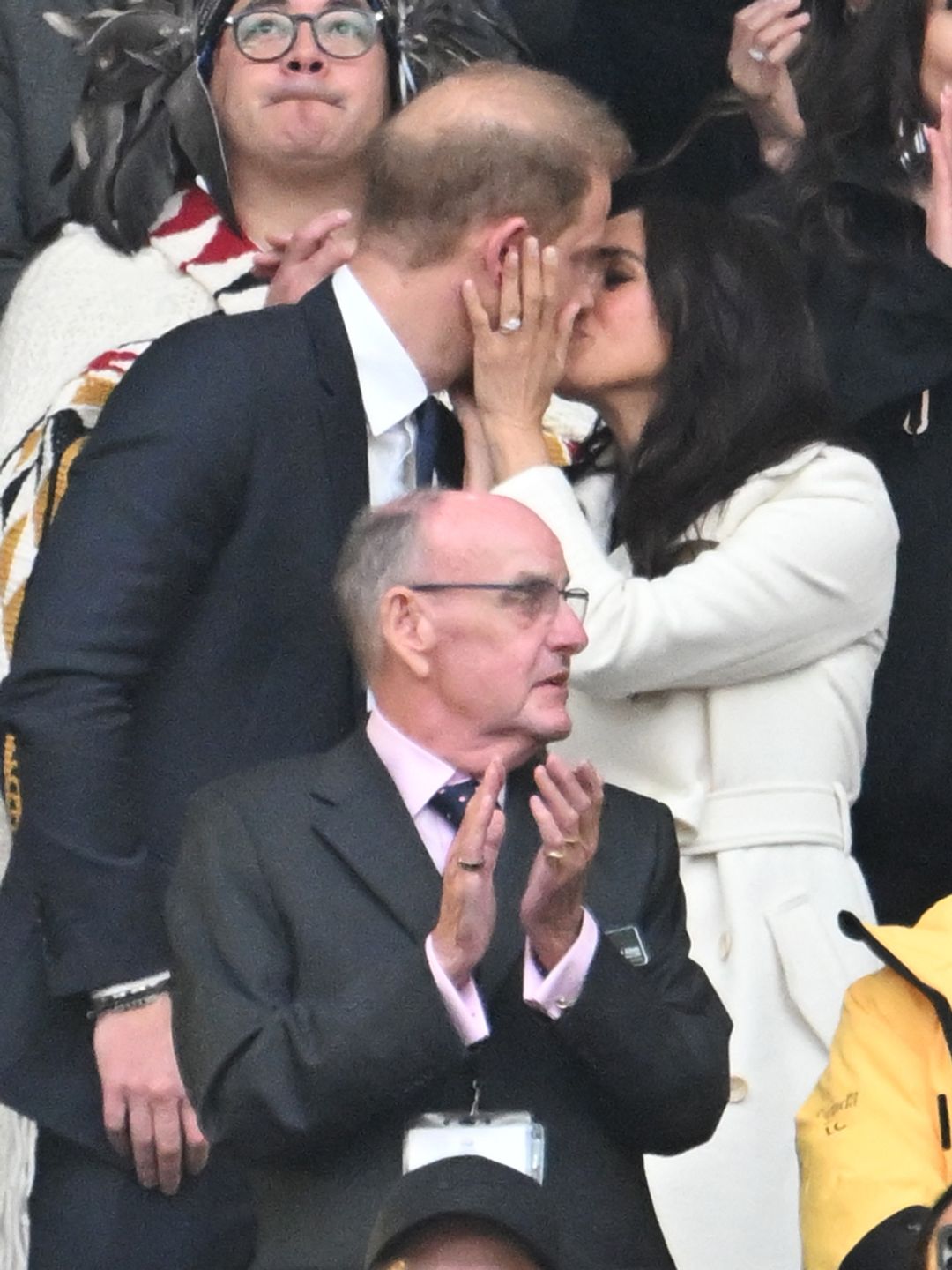 Prince Harry, Duke of Sussex and Meghan, Duchess of Sussex kiss during the opening ceremony 