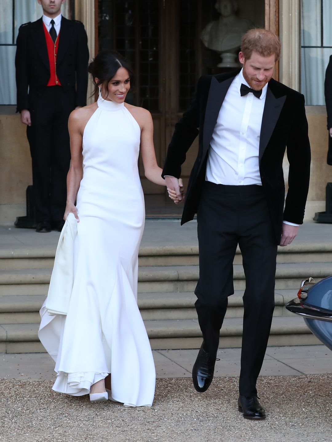 Meghan Markle wears a white halter neck gown at her 2018 with Prince Harry