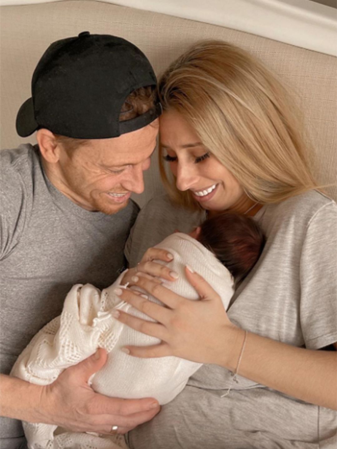 Stacey Solomon poses with husband Joe Swash and baby Belle