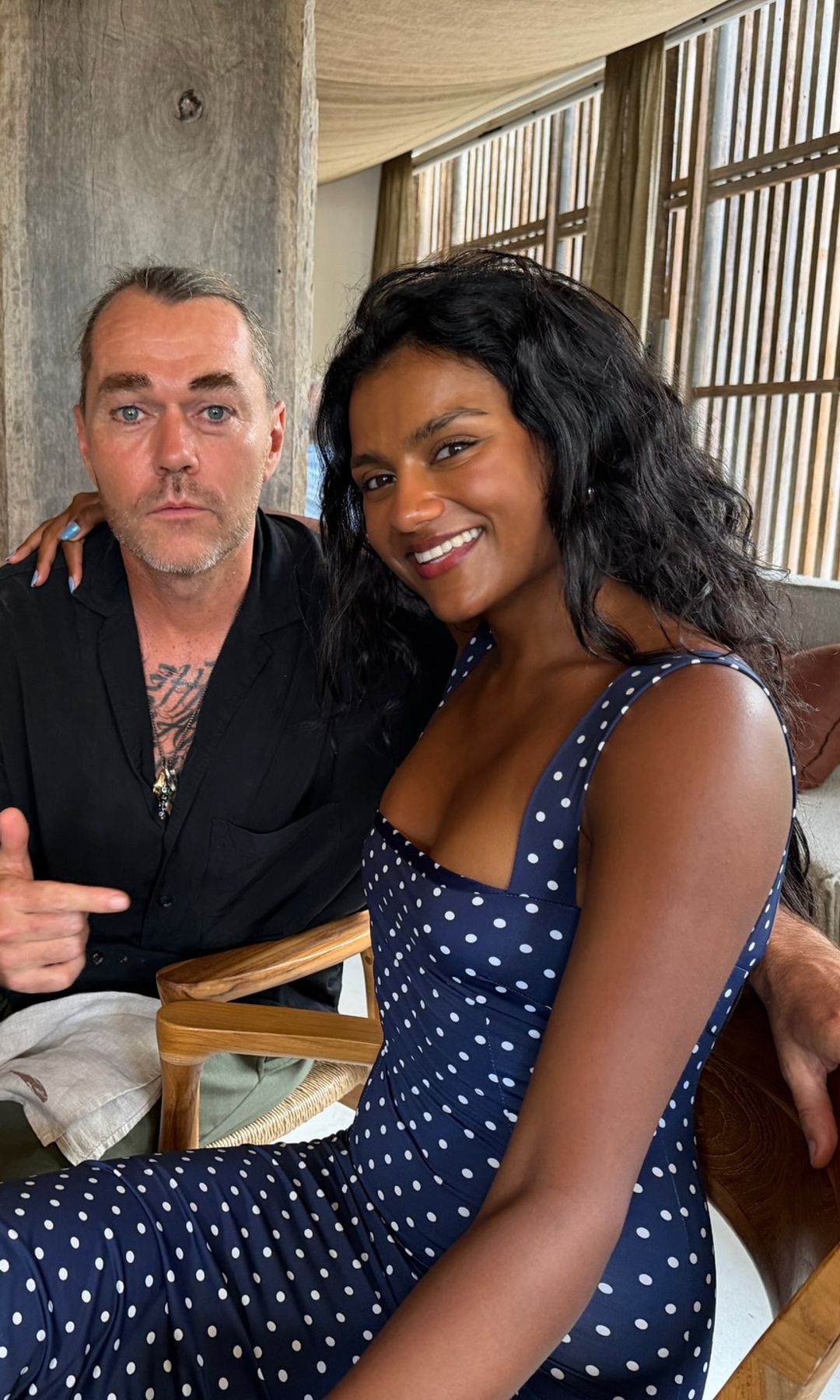 Simone Ashley poses in a polkadot dress on holiday